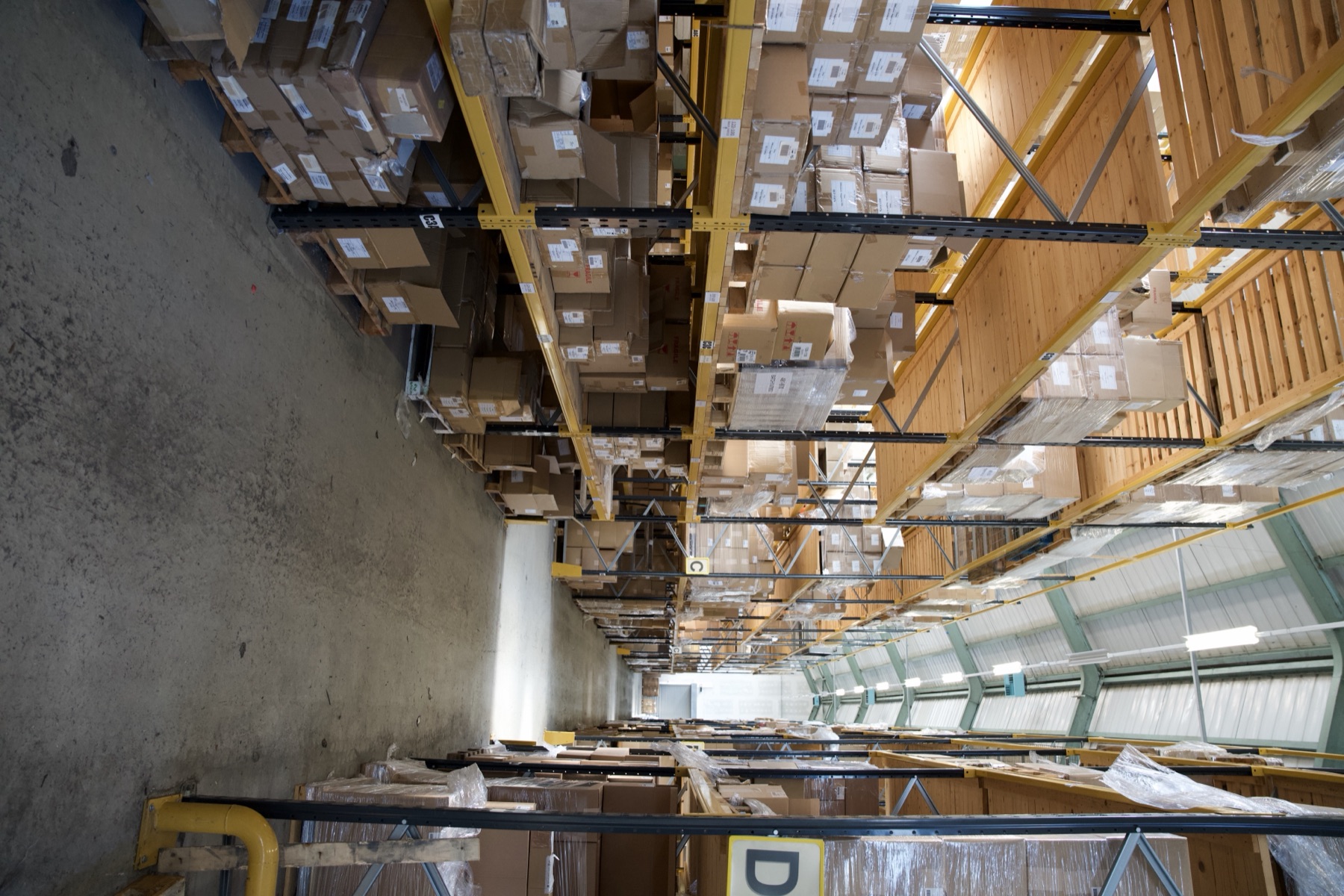 Racked warehouse aisle at Alplas
