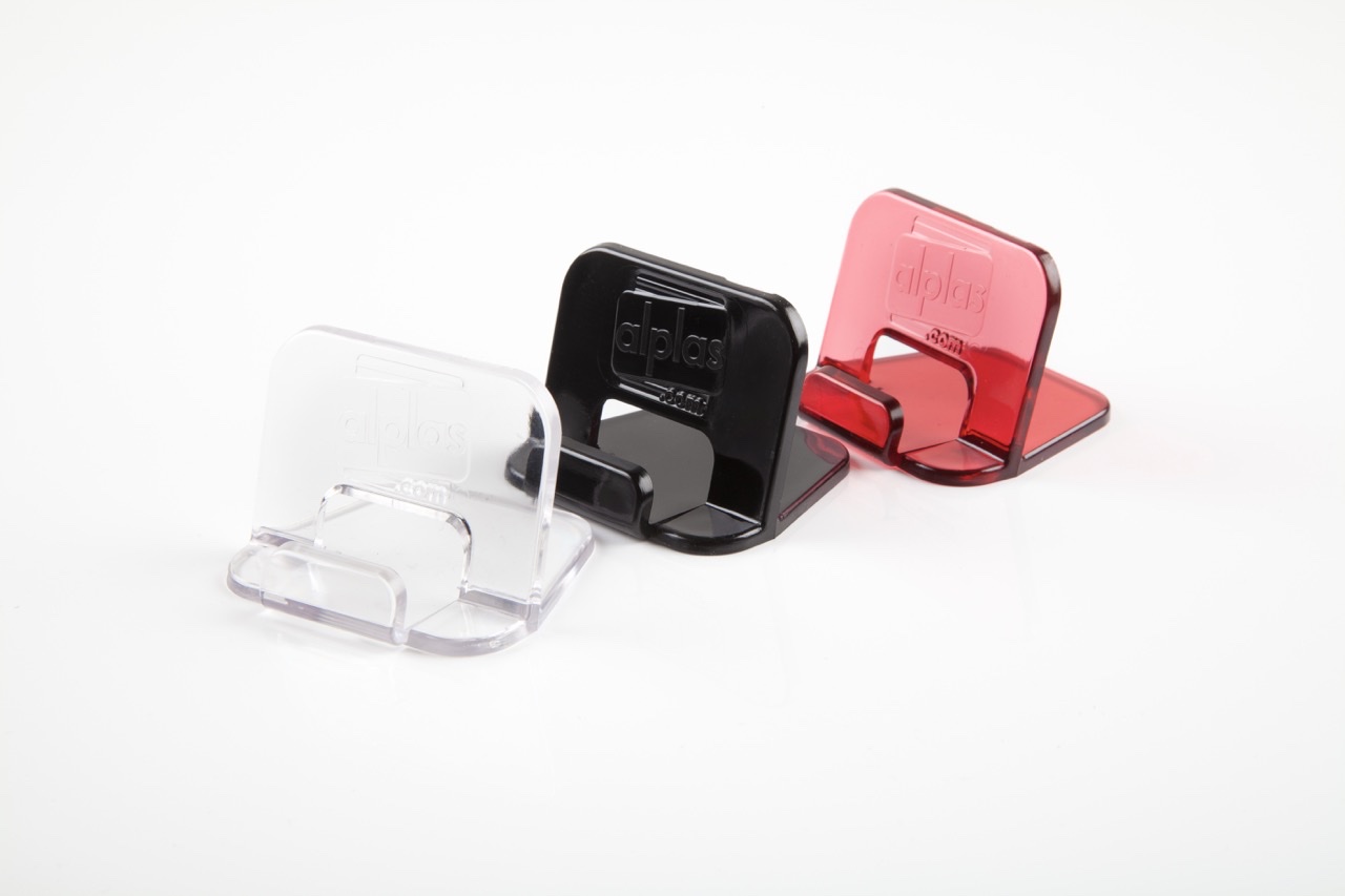 Finished phone holders in clear, black and red